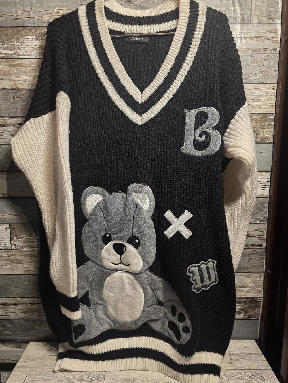 AKIRA Black Cream V-Neck Teddy Appliqué Sweater